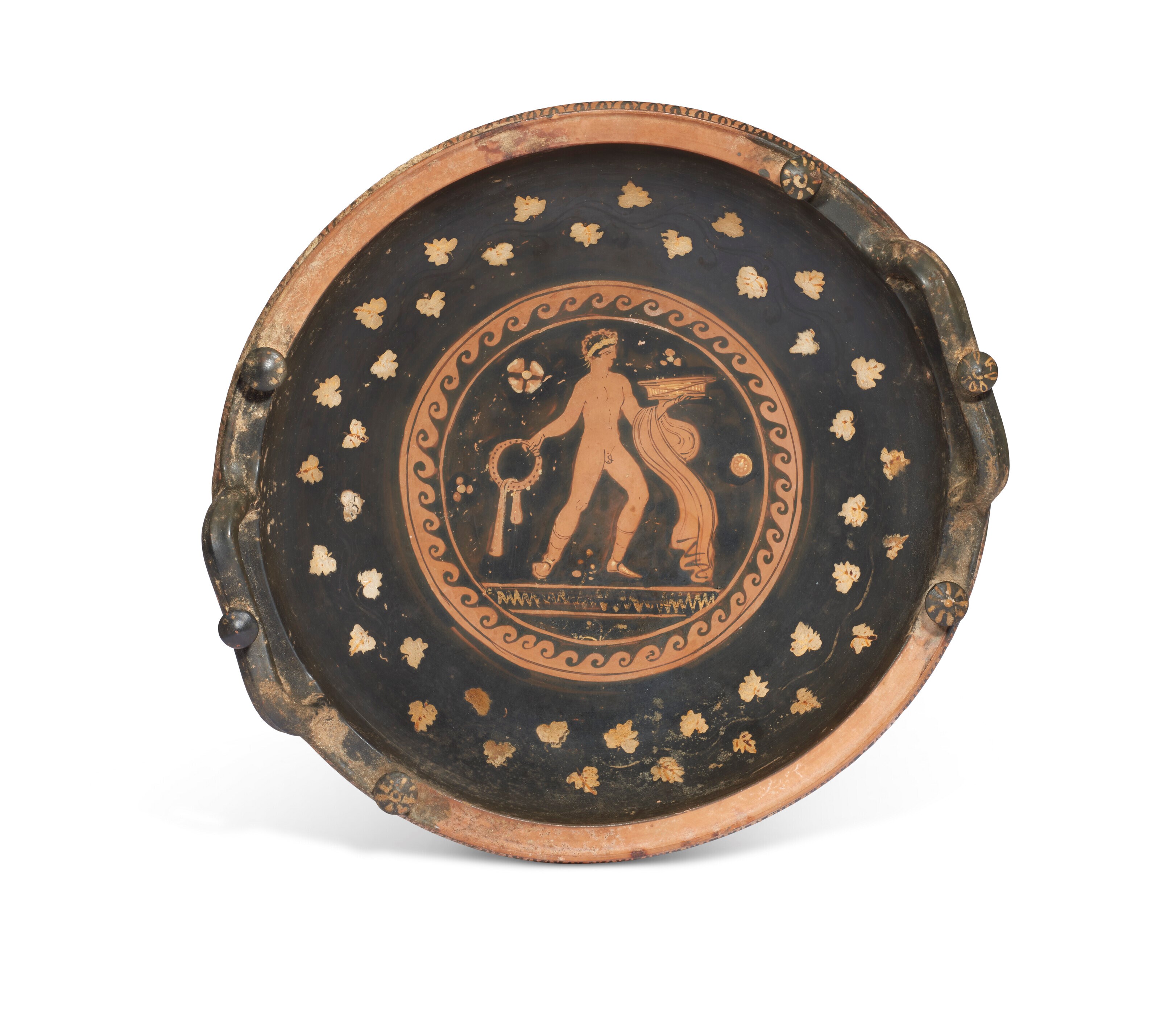 AN APULIAN RED-FIGURED KNOB-HANDLED PATERA