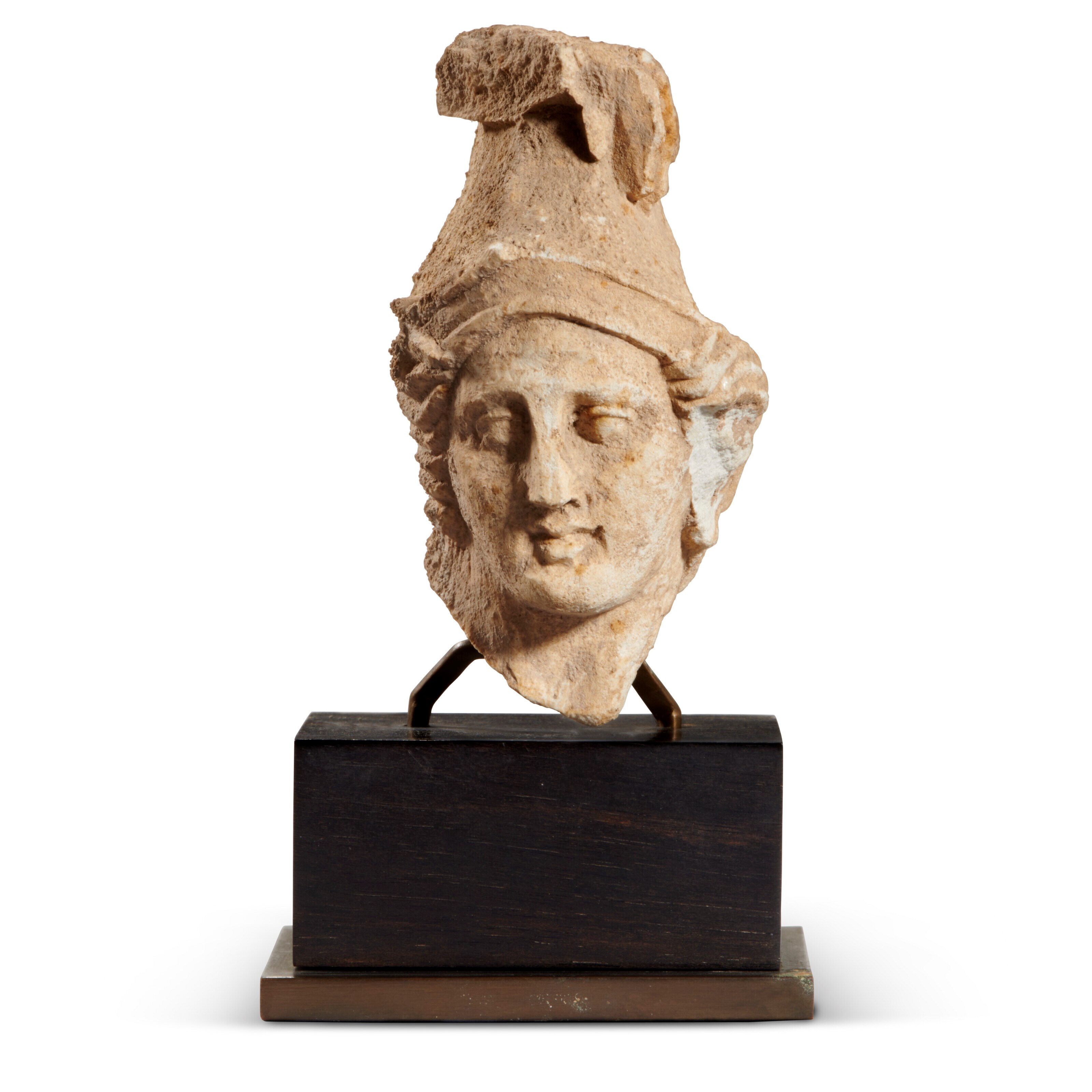 A GREEK LIMESTONE HEAD OF ATHENA