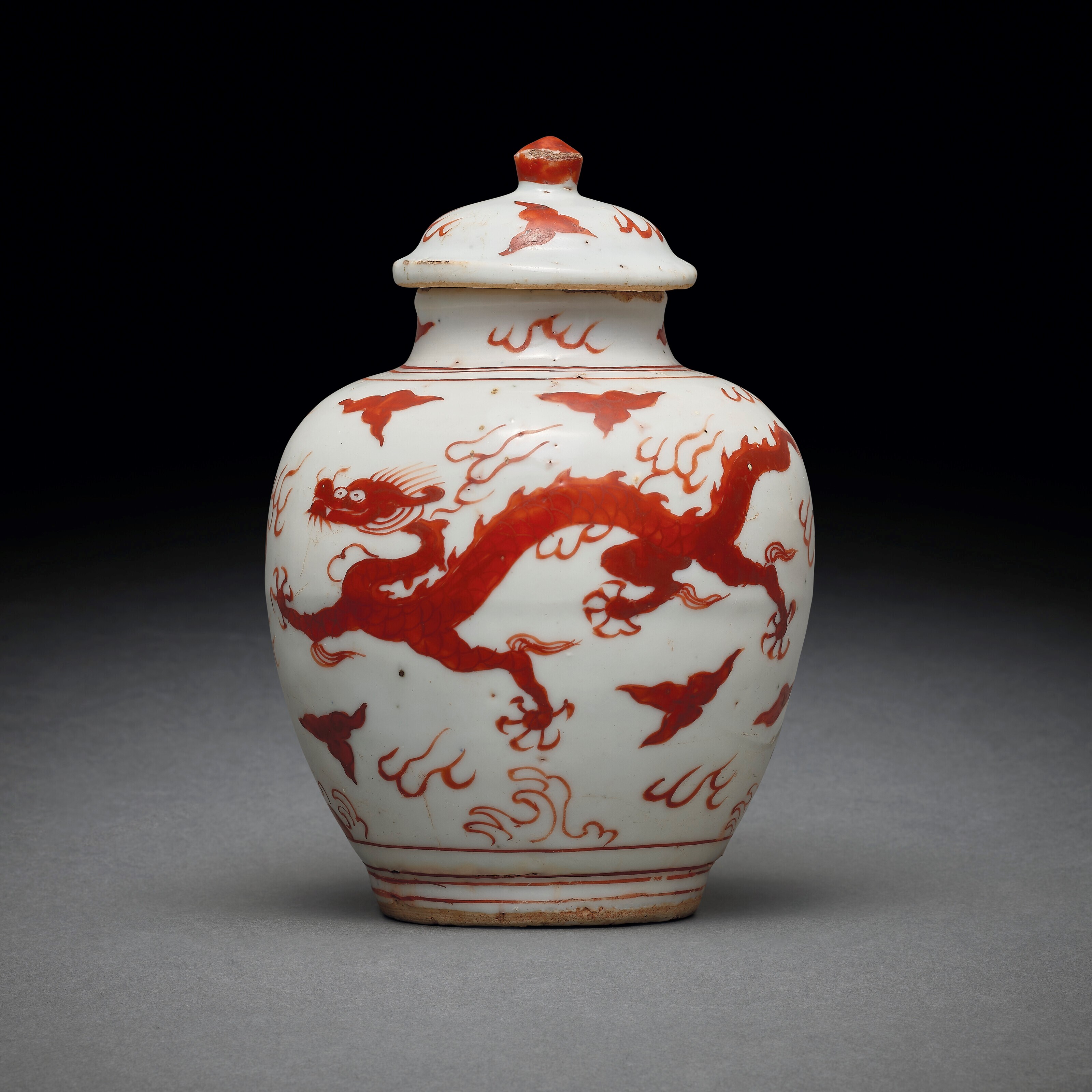 A SMALL AND RARE IRON-RED-DECORATED `DRAGON’ JAR AND COVER