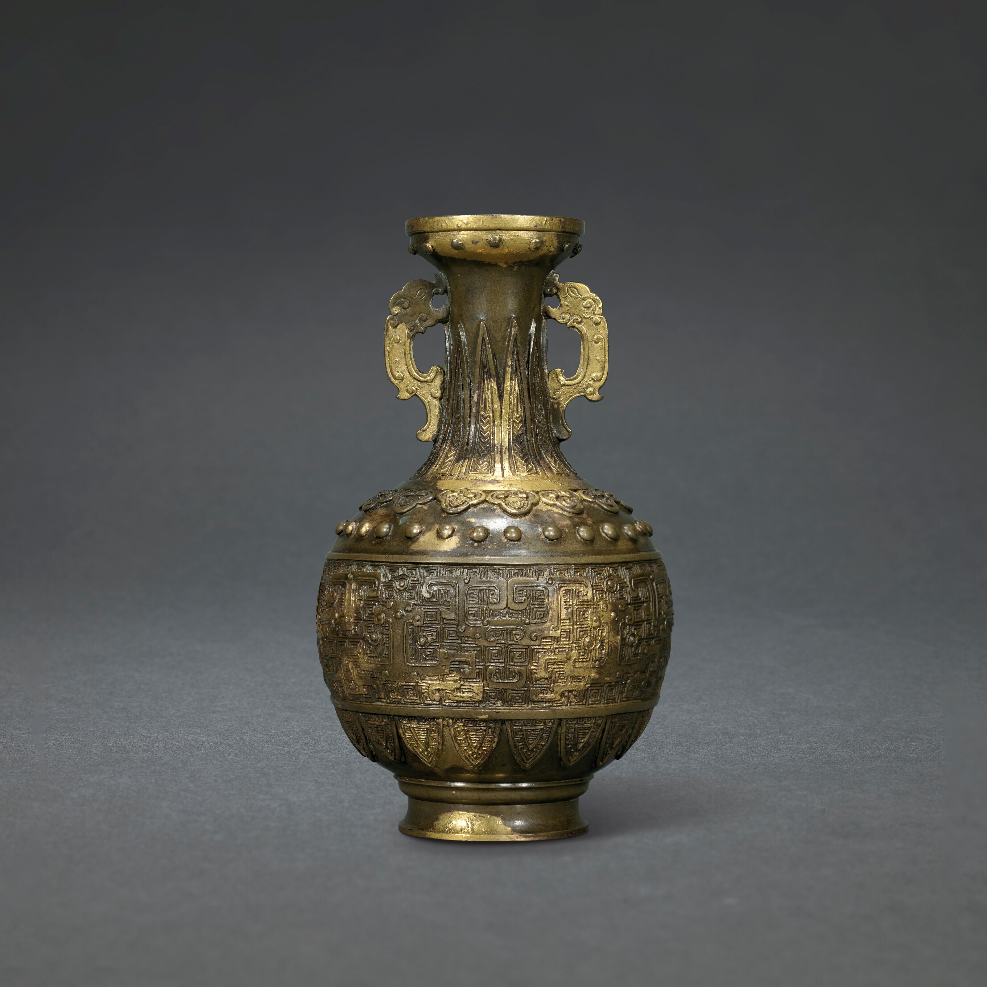 A GILT-SPLASHED BRONZE VASE