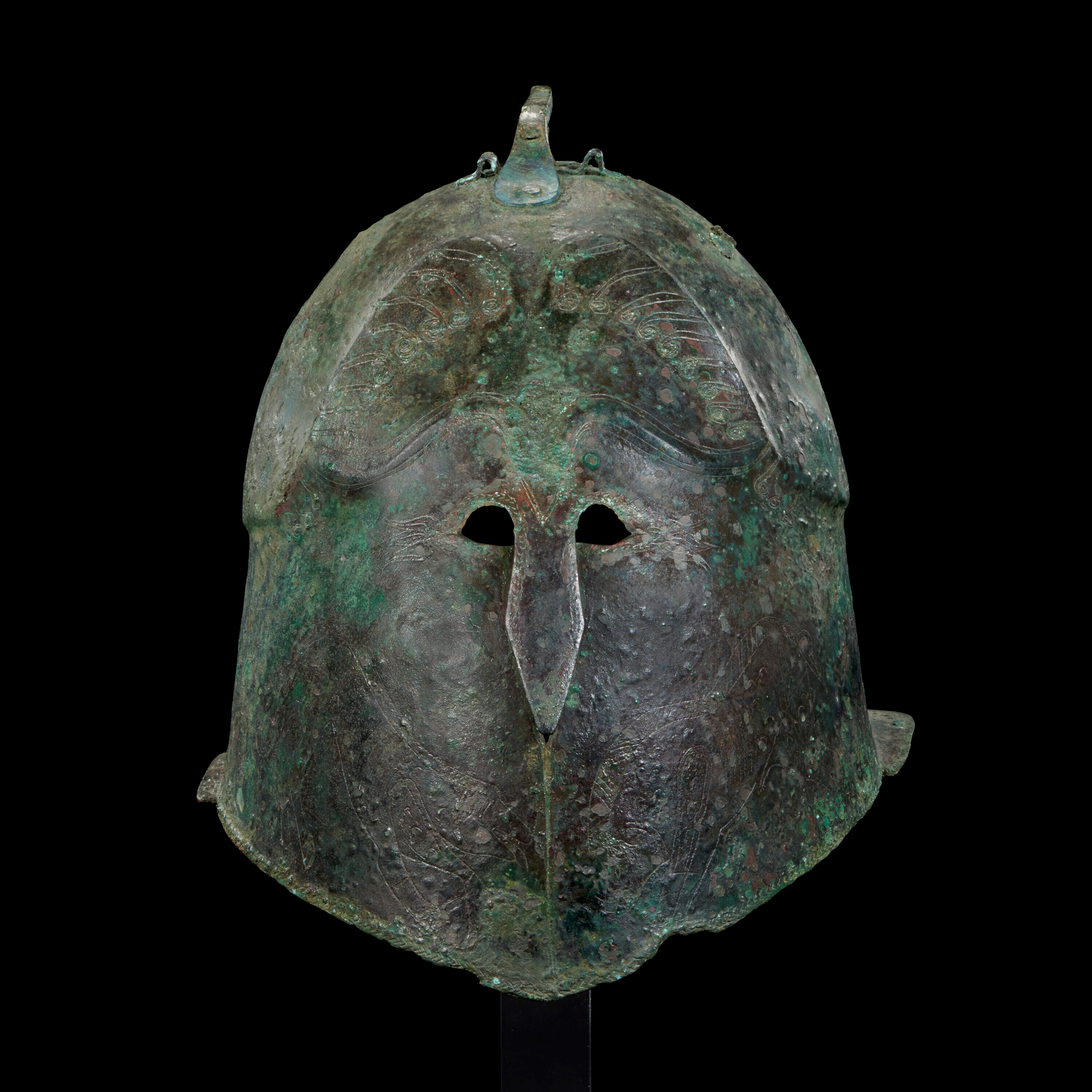A GREEK BRONZE PSEUDO-CORINTHIAN HELMET