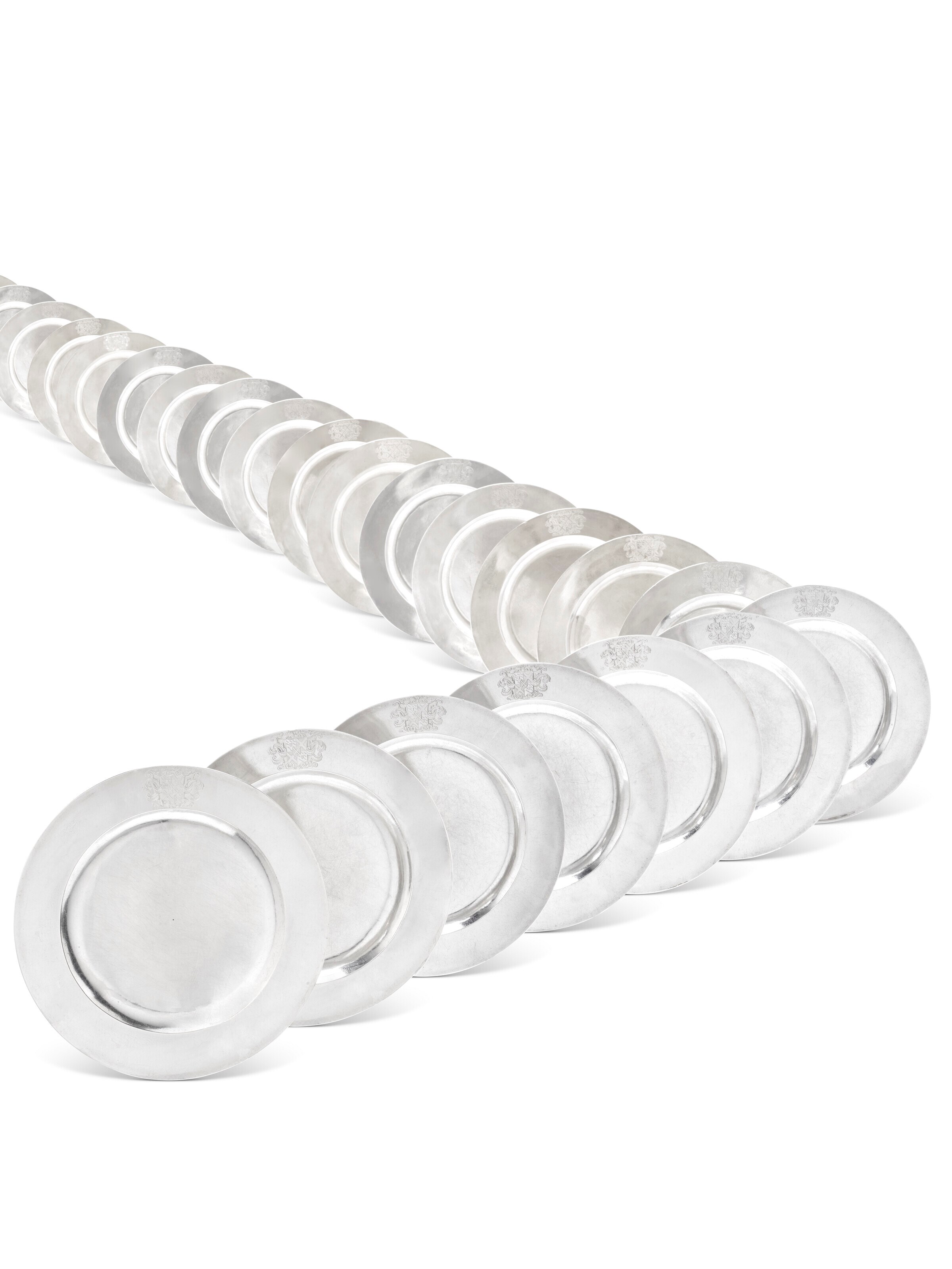 A SET OF TWENTY-FOUR GEORGE I SILVER DINNER PLATES FROM THE WINNINGTON SERVICE