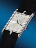 CARTIER. A RARE AND UNUSUAL PLATINUM LIMITED EDITION ASYMMETRICAL WRISTWATCH