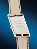 CARTIER. A RARE AND UNUSUAL PLATINUM LIMITED EDITION ASYMMETRICAL WRISTWATCH