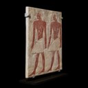 AN EGYPTIAN POLYCHROME LIMESTONE RELIEF FRAGMENT