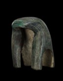 AN EGYPTIAN BRONZE WIG