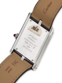 CARTIER. A RARE AND UNUSUAL PLATINUM LIMITED EDITION ASYMMETRICAL WRISTWATCH