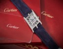 CARTIER. A VERY RARE AND UNUSUAL PLATINUM LIMITED EDITION SKELETONIZED ASYMETRICAL WRISTWATCH