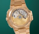 PATEK PHILIPPE. A VERY RARE AND SOUGHT AFTER 18K PINK GOLD AUTOMATIC FLYBACK CHRONOGRAPH DUAL TIME WRISTWATCH WITH DATE, DAY/NIGHT INDICATOR AND BRACELET