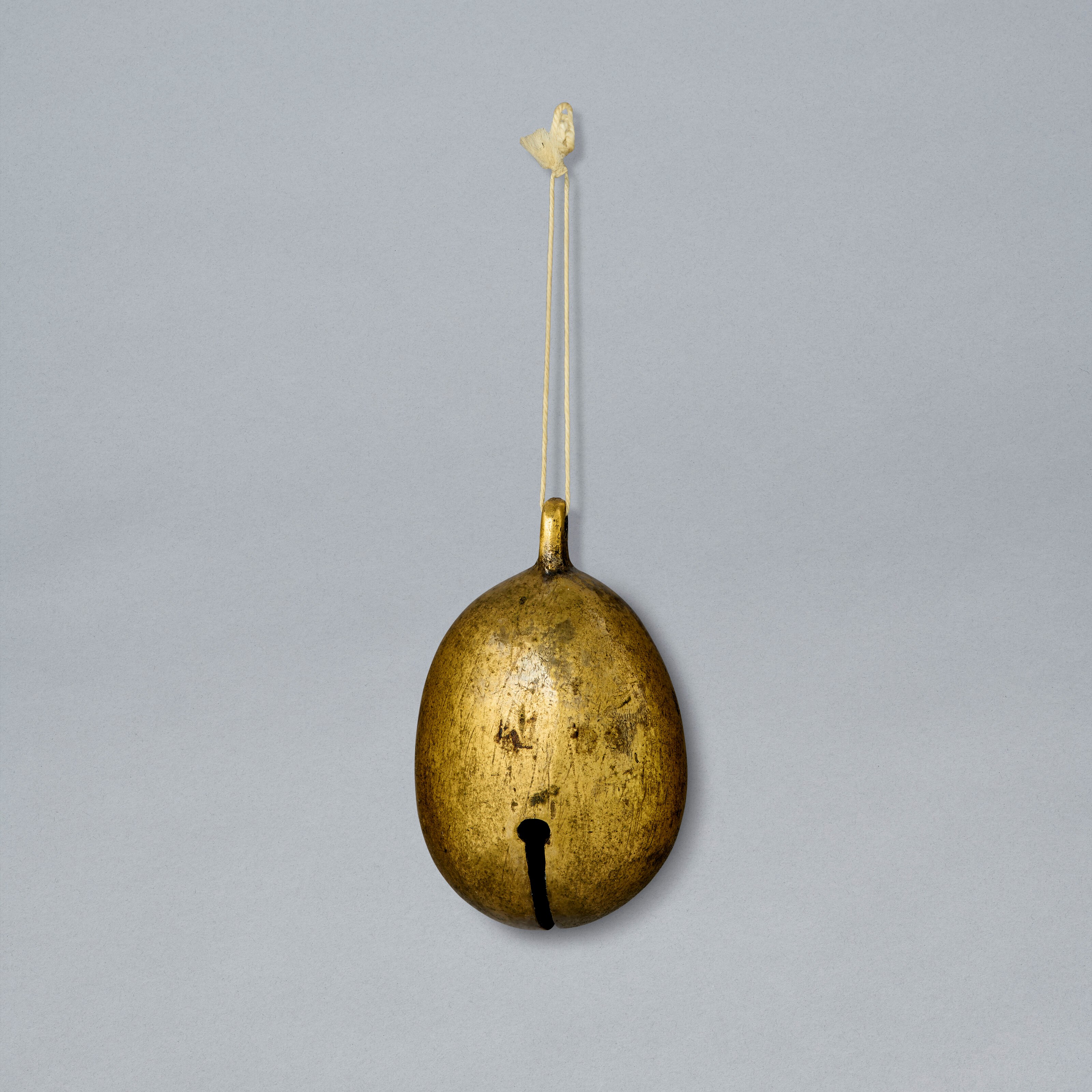 A SMALL GILT-BRONZE BELL