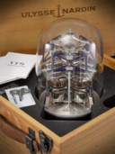 ULYSSE NARDIN. A VERY RARE AND UNUSUAL ALUMINIUM AND BLOWN GLASS LIMITED EDITION SCULPTURAL TRIPLE TIME ZONE TABLE CLOCK WITH ONE-YEAR POWER RESERVE
