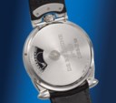DE BETHUNE. AN EXTREMELY RARE AND AVANT-GARDE PLATINUM SEMI-SKELETONIZED HORSESHOE-SHAPED WRISTWATCH WITH SPHERICAL MOON PHASES AND POWER RESERVE INDICATION