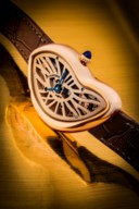 CARTIER. AN ATTRACTIVE AND VERY RARE 18K PINK GOLD LIMITED EDITION SKELETONISED ASYMMETRICAL WRISTWATCH