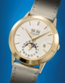 PATEK PHILIPPE. A VERY RARE AND ELEGANT 18K GOLD AUTOMATIC PERPETUAL CALENDAR WRISTWATCH WITH MOON PHASES AND LEAP YEAR INDICATION