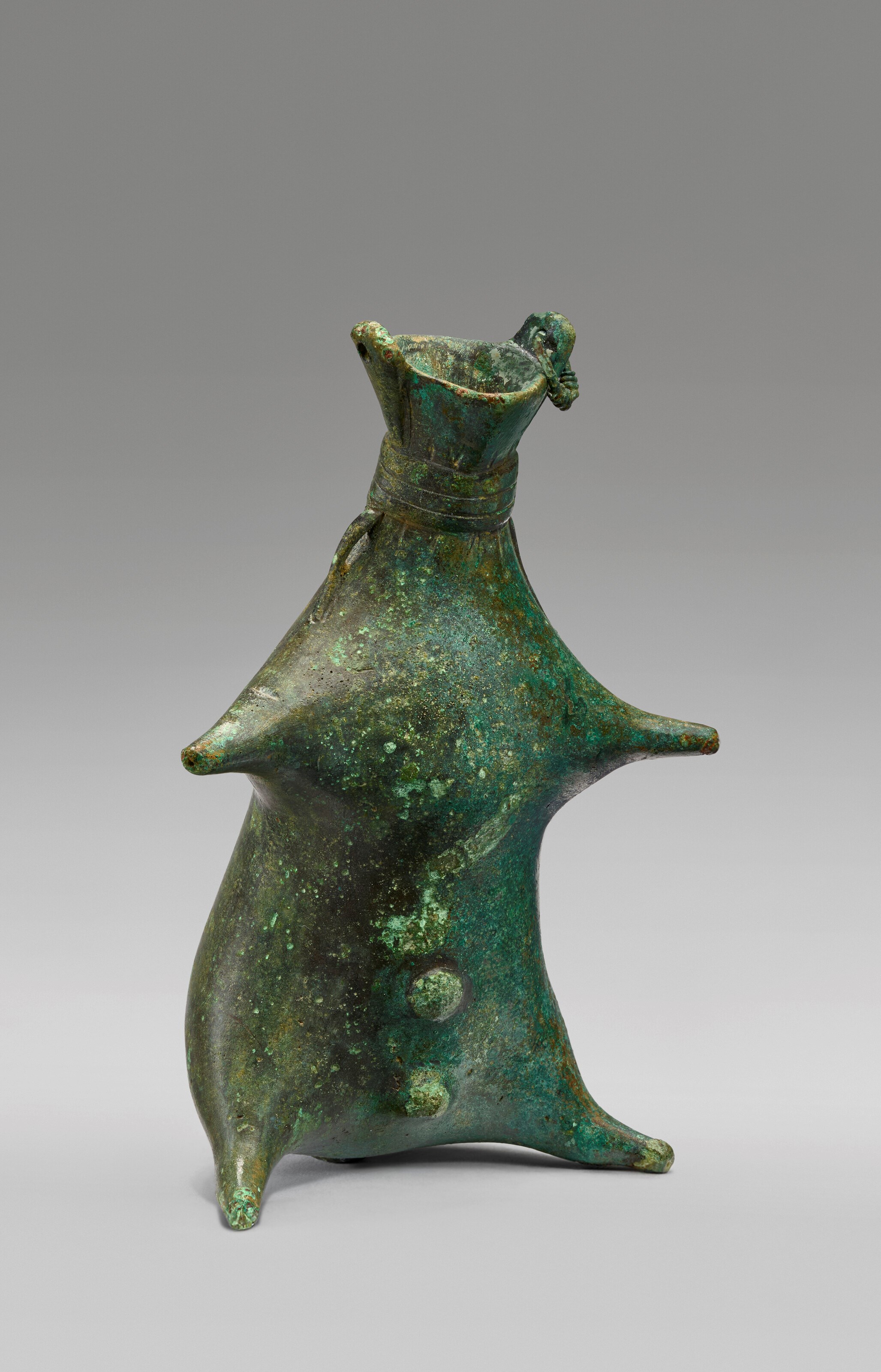 A GREEK BRONZE BALSAMARIUM IN THE FORM OF A WINESKIN