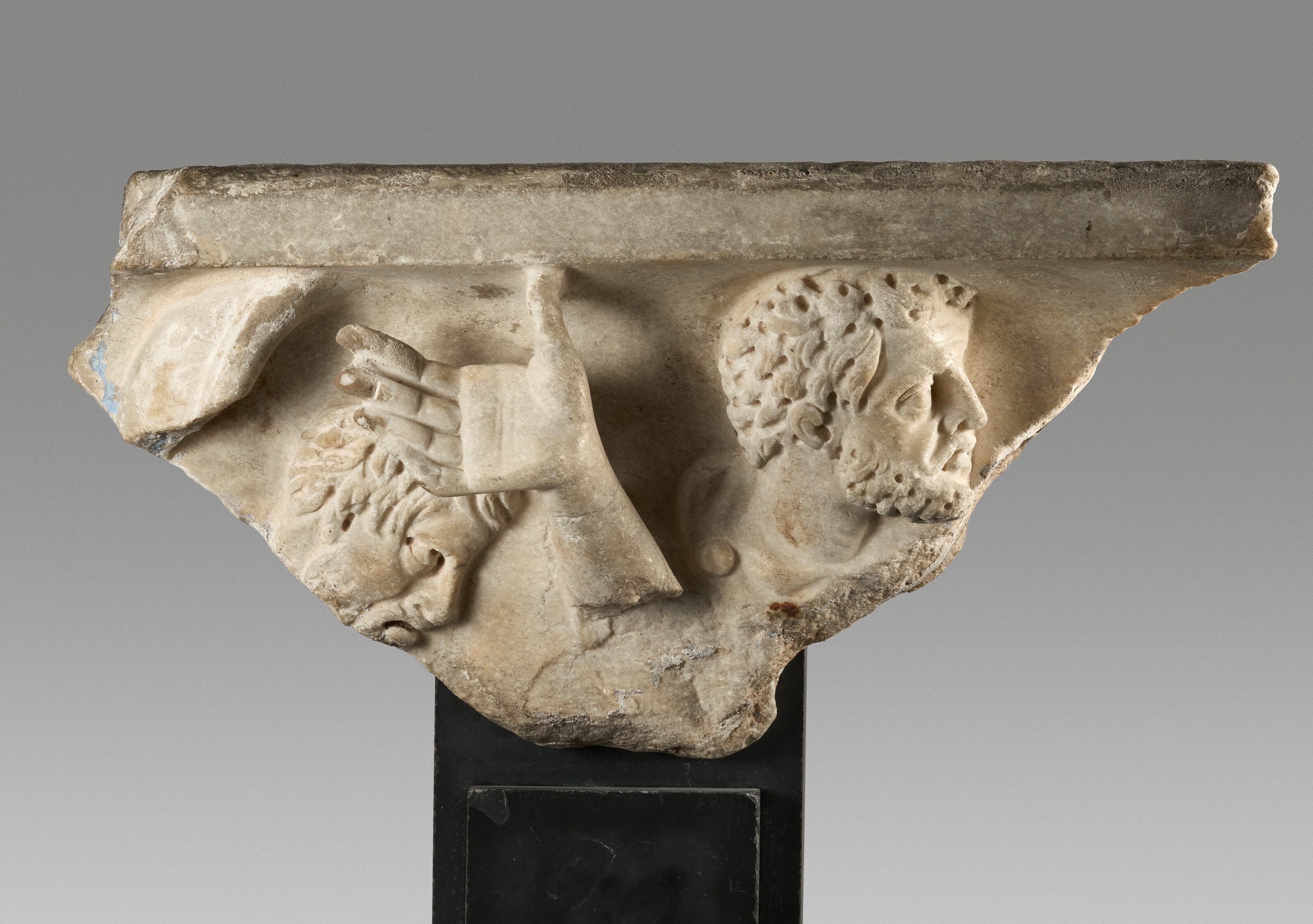 A ROMAN MARBLE SARCOPHAGUS FRAGMENT