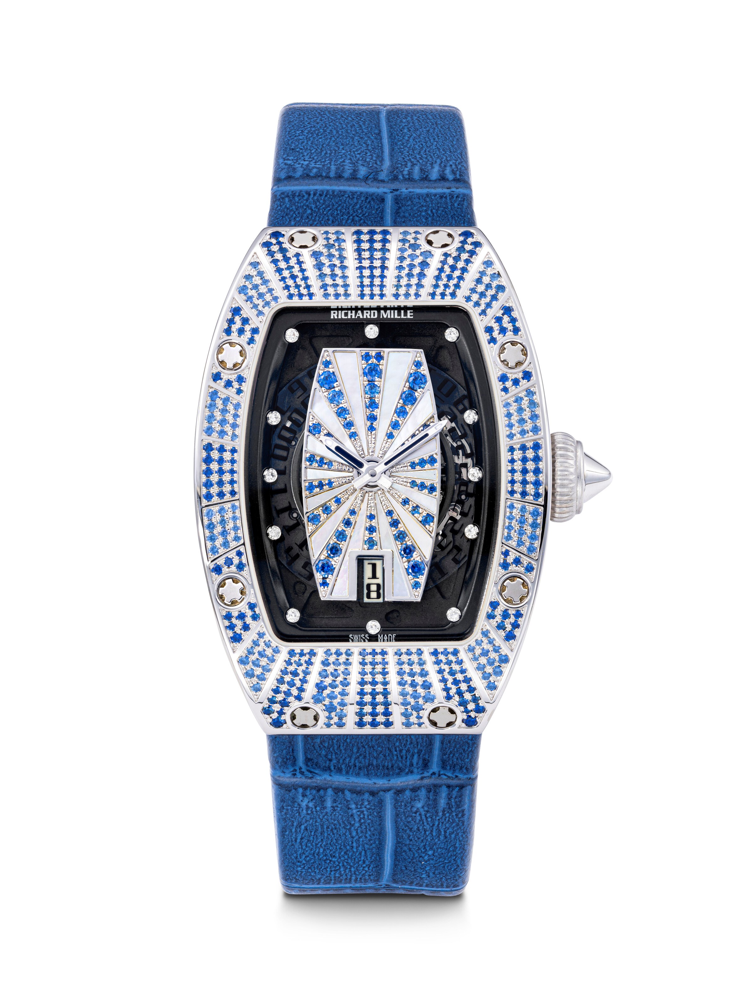RICHARD MILLE. A LADY’S CHARMING 18K WHITE GOLD, DIAMOND AND SAPPHIRE-SET AUTOMATIC SEMI-SKELETONISED WRISTWATCH WITH DATE AND MOTHER-OF-PEARL DIAL