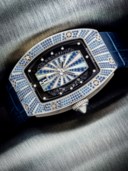 RICHARD MILLE. A LADY’S CHARMING 18K WHITE GOLD, DIAMOND AND SAPPHIRE-SET AUTOMATIC SEMI-SKELETONISED WRISTWATCH WITH DATE AND MOTHER-OF-PEARL DIAL