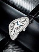 CARTIER. A RARE 18K WHITE GOLD AND DIAMOND-SET ASYMMETRICAL WRISTWATCH