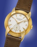 PATEK PHILIPPE. A HIGHLY UNUSUAL AND ATTRACTIVE 18K GOLD WRISTWATCH WITH FANCY LUGS