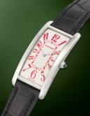 CARTIER. A UNIQUE AND EXTREMELY ATTRACTIVE PLATINUM LARGE RECTANGULAR CURVED WRISTWATCH WITH RED ARABIC NUMERAL DIAL