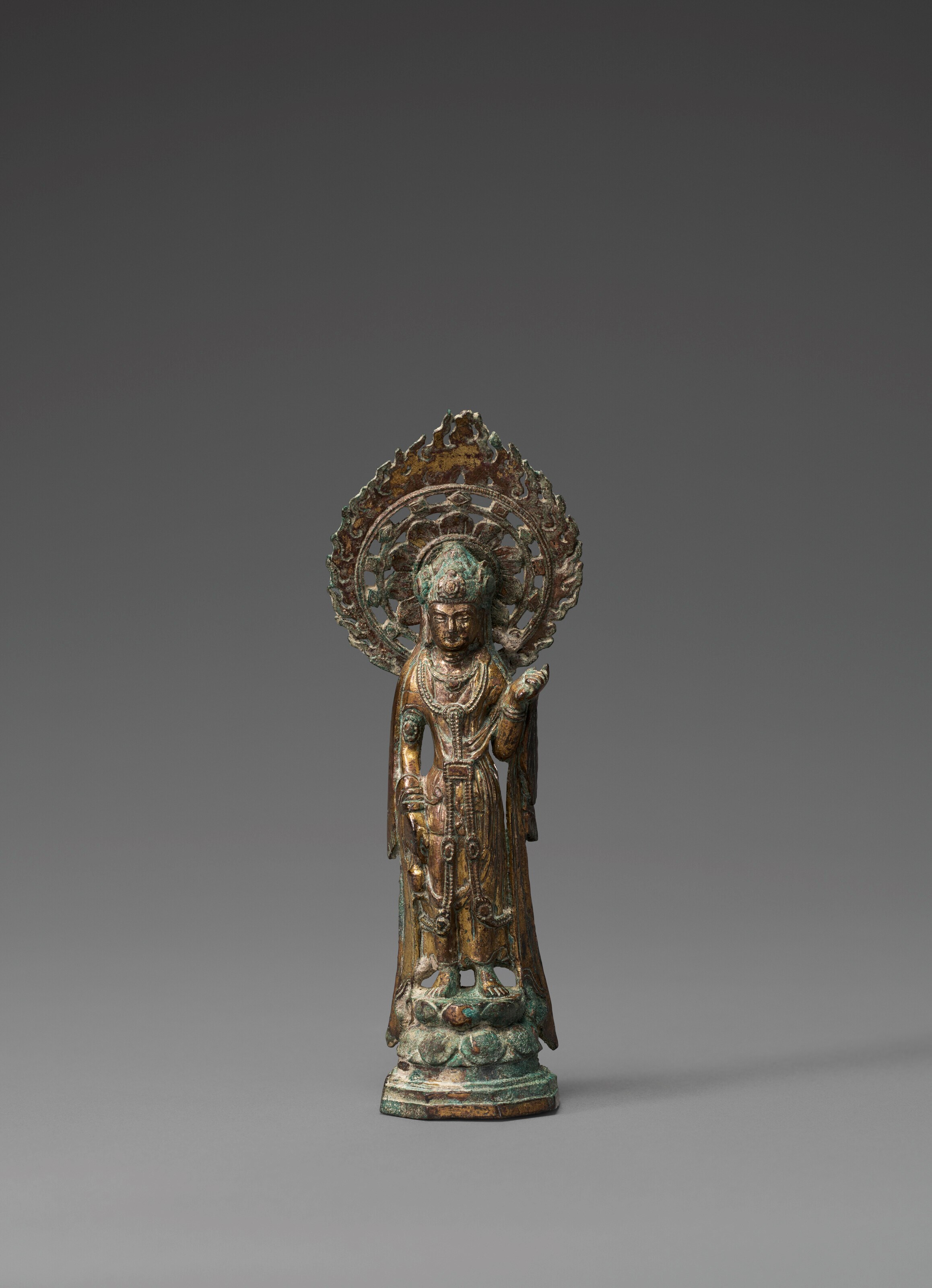 A GILT-BRONZE FIGURE OF STANDING GUANYIN
