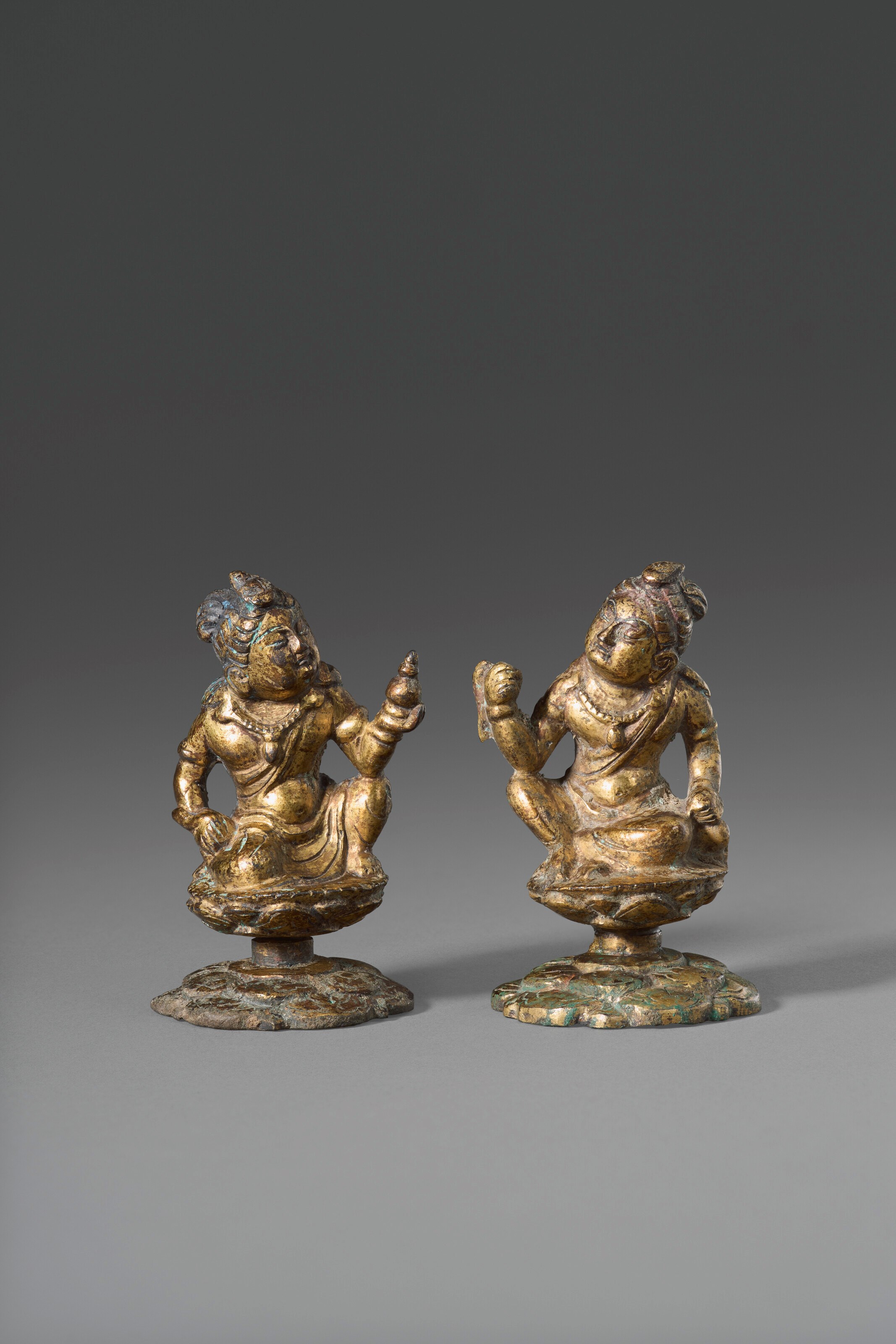 A PAIR OF SMALL GILT-BRONZE FIGURES OF BODHISATTVAS