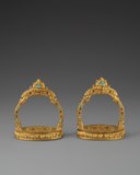 A VERY RARE AND EXCEPTIONAL PAIR OF EMBELLISHED GILT-BRONZE STIRRUPS