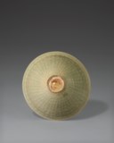 A MOLDED YAOZHOU CELADON 'FLORAL SCROLL' BOWL