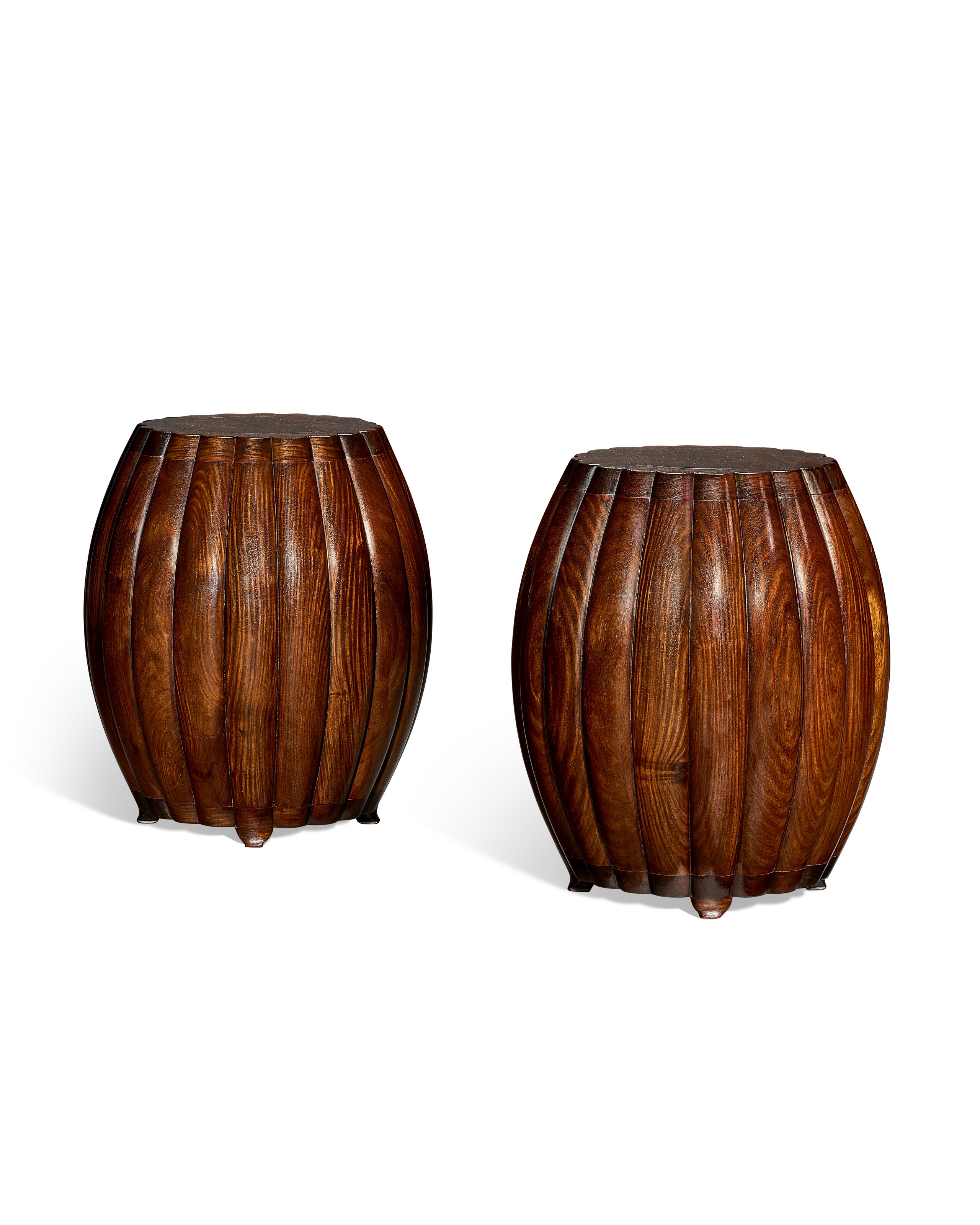 A RARE PAIR OF MELON-FORM HUANGHUALI STOOLS