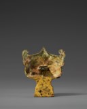 A POWERFULLY CAST GILT-BRONZE MASK-FORM SUPPORT
