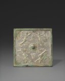 A RARE SILVERY-BRONZE 'APSARA' SQUARE MIRROR
