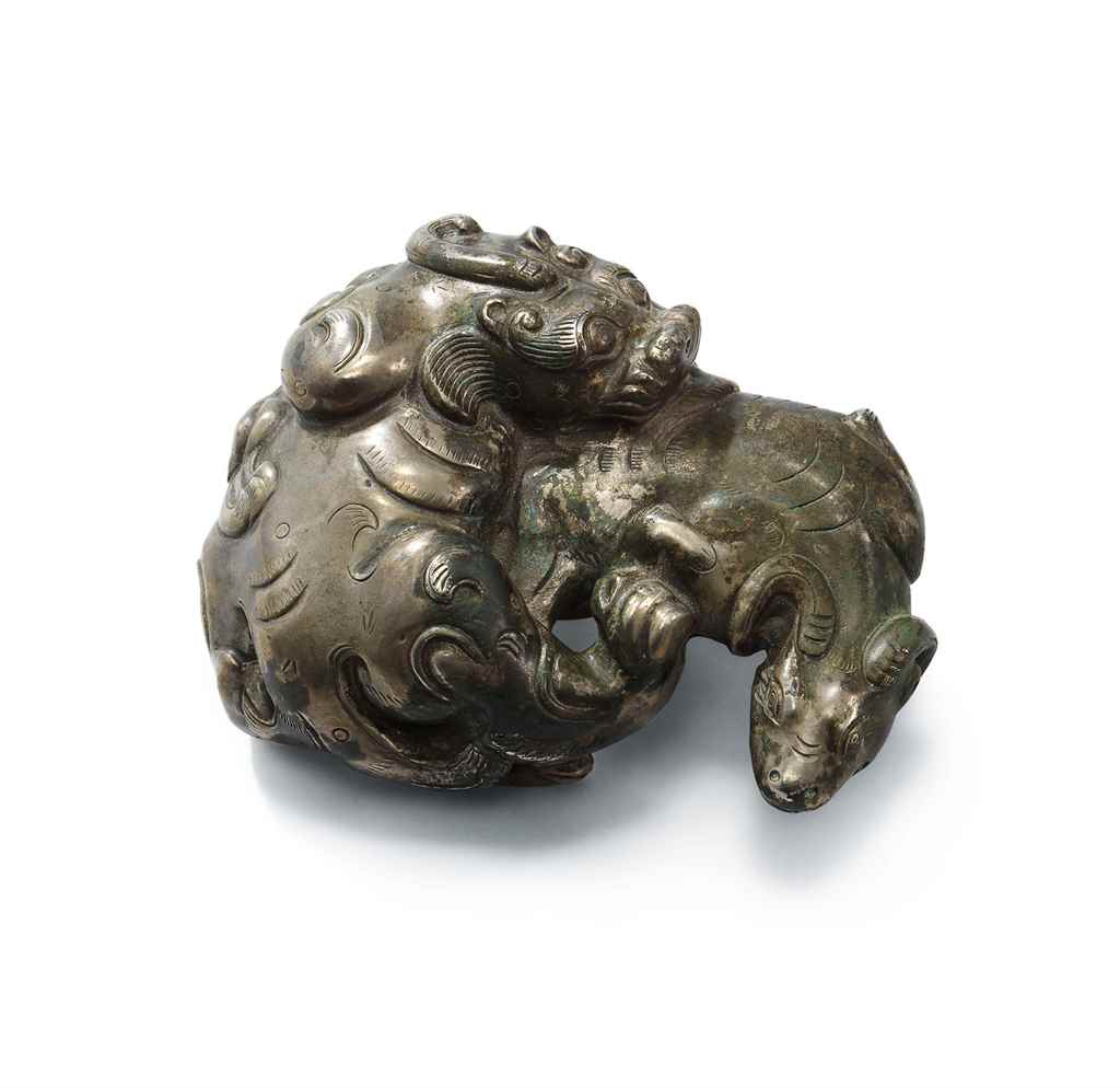 A Silver &lsquo;Suanni and Ram&rsquo; paperweight, Ming dynasty or later. 4 in (10 cm) wide.  Sold for HK$37,500 on 4 April 2017 at Christie&rsquo;s in Hong Kong