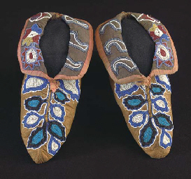 A PAIR OF CHEROKEE BEADED HIDE MOCCASINS | Christie's