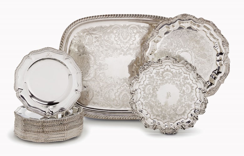 Three silver-plate serving trays and an assembled set of 18 George IV Sheffield plate service plates. The trays 20th century, the plates mid-19th century. Estimate $1,000-1,500. This lot is offered in the Private Collection of Joan Rivers sale on 22 June at Christies New York