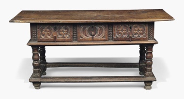 A Spanish chestnut side table. Late 17thearly 18th century. 31 in (79 cm) high; 67¼ in (171 cm) wide; 28 in (71 cm) deep. Estimate £2,000-4,000. Also depicted in Bravo’s painting on the right A William and Mary walnut mirror. Late 17th century, possibly Dutch. 39 x 34 in (99 x 86.5 cm). Estimate £2,500-4,000; Three Spanish walnut armchairs. 17th-19th century. The