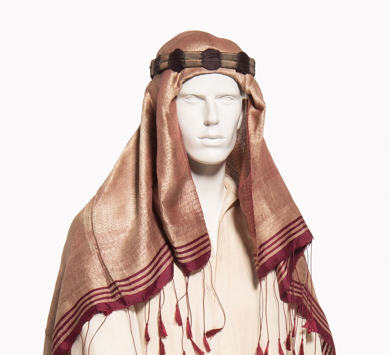 Thomas Edward Lawrence (Lawrence of Arabia). A red silk and gold thread head scarf, early 20th century. Estimate £3,000-5,000. This lot is offered in the Out of the Ordinary sale on 14 September at Christies South Kensington. 