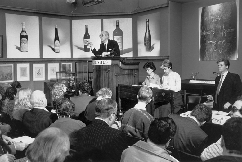 Michael Broadbent in the podium for a Christie’s wine auction