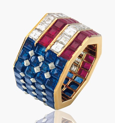 A diamond, sapphire and ruby ring, by Bulgari. Set with square-cut sapphires, rubies and diamonds in an American flag motif, ring size 5 ½. Estimate $5,000-7,000. This lot will be offered in The Private Collection of President and Mrs. Ronald Reagan, 21-22 September at Christies in New York