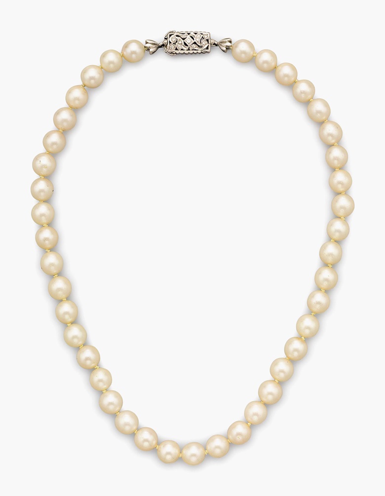 Cultured pearl and diamond necklace. Designed as a strand of cultured pearls with a diamond and white-gold clasp. Metal 18k. Diamonds 11 round diamonds with approximate total weight of 0.15 carats. Cultured pearls 41 round cultured pearl beads measuring approximately 8.5 mm. 16½ inches in length. Marks ITALY, 18K. Gross Weight 41.9 grams. Estimate $1,000-$1,500. This lot is offered in the
