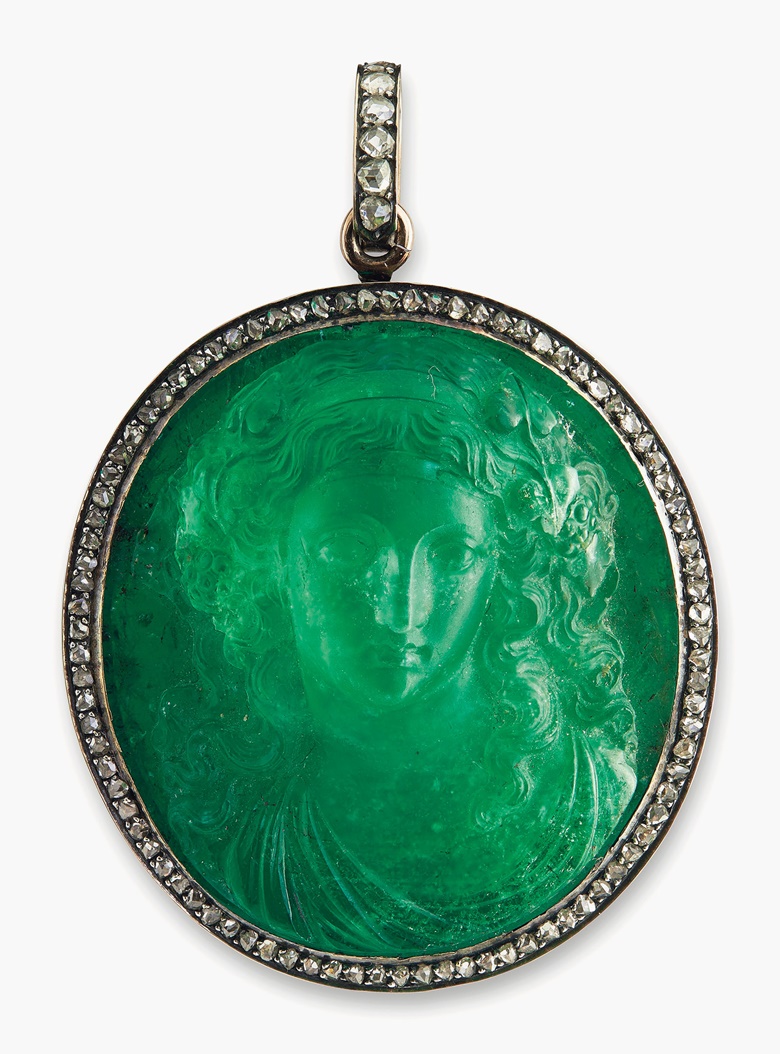 A Historic Emerald and Diamond Pendant. The emerald cameo in high relief depicting a female bust within a rose-cut diamond surround and detachable pendant hoop, mounting c. 1900, 6 cm. Sold for CHF 181,250 on 15 November 2016 at Christie’s in Geneva