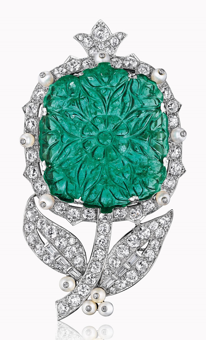 An emerald, pearl and diamond flower brooch, by Cartier. Sold for $487,500 on 7 December 2016