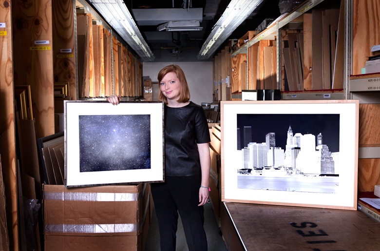 Lindsay Griffith, Prints specialist, with her choice of Night Sky 3, 2003, by Vija Celmins, alongside Fulton Ferry Landing, Manhattan Skyline, Brooklyn, New York, June 1996, by Vera Lutter, from 1996