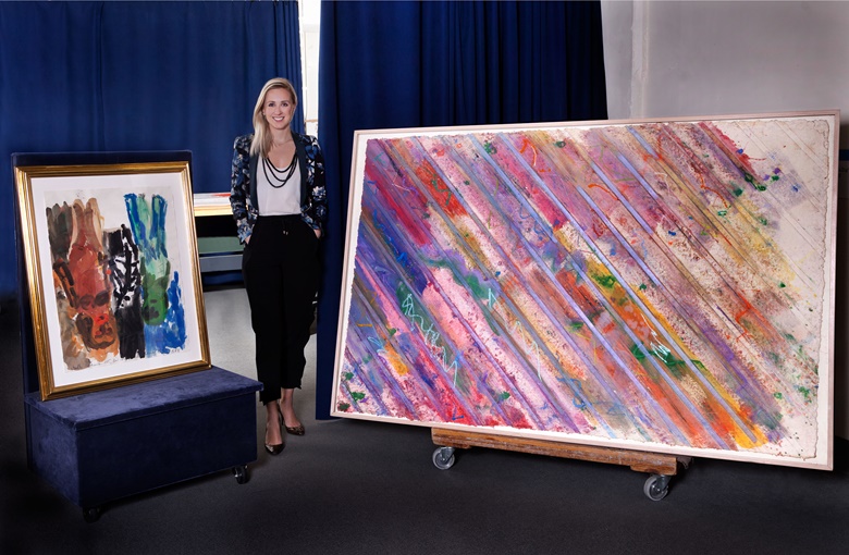 Rachael White, Post-War and Contemporary Art specialist, with George Baselitz’s Untitled (Red Mother with Child), painted in 1985, and the larger Rains, by Kenneth Noland, from the same year