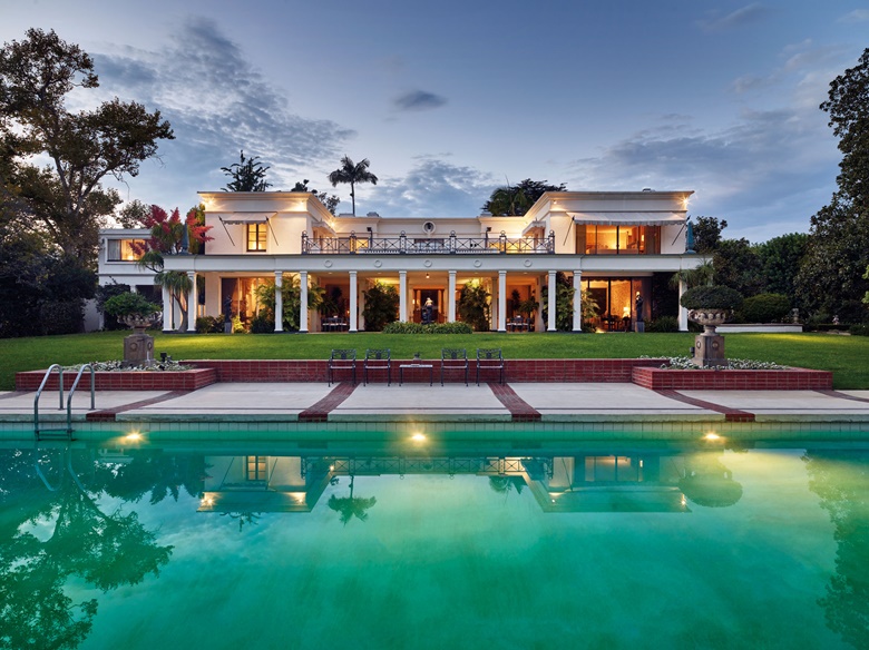 The view of the Bloomingdale residence from the pool. Photograph by Spencer Lowell.