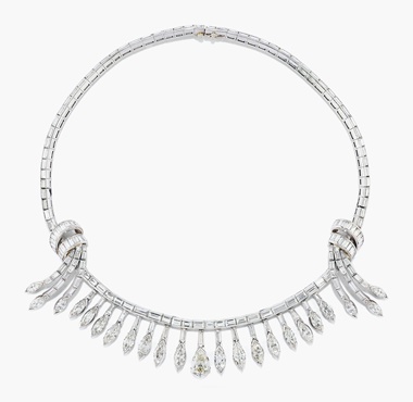 A diamond fringe necklace. The baguette-cut diamond line with tied ribbon detail, suspending a fringe of graduated marquise cut diamonds tassels with central pear-shaped diamond drop, 36.0 cm. Estimate CHF 20,000-25,000. This lot is offered in Magnificent Jewels on 17 May at Christie’s in Geneva