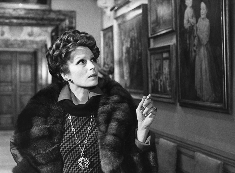 Actress Silvana Mangano wearing a quartz, onyx and diamond pendantbrooch necklace by Bulgari, offered in the Magnificent Jewels sale in Geneva, in the 1974 movie Conversation Piece (Gruppo di Famiglia in un Interno) © Mario Tursi Archivio Storico del Cinema AFE