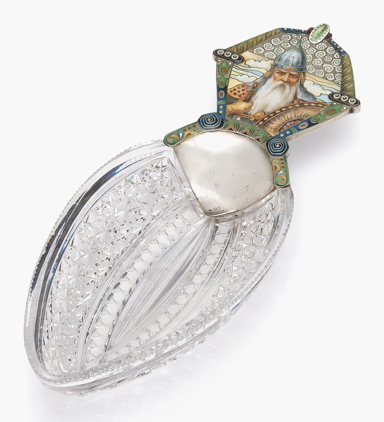 A silver-mounted en plein and cloisonné enamel cut-glass dish marked Khlebnikov with the Imperial Warrant, Moscow 1908-1917. 13¼ in (33.6 cm) long. This work was offered in the Russian Art sale on 5 June 2017 at Christies London and sold for £35,000
