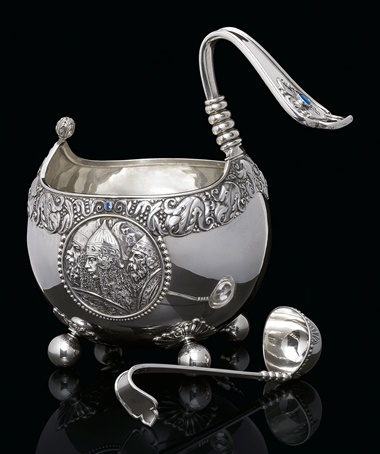 An impressive gem-set silver kovsh and ladle. Marked K. Fabergé with the Imperial warrant, Moscow, 1899-1908. The kovsh 13⅝ in (34.6 cm) high; the ladle 10¼ in (26 cm) long. This lot was offered in Russian Art on 5 June 2017 at Christie’s in London and sold for £87,500