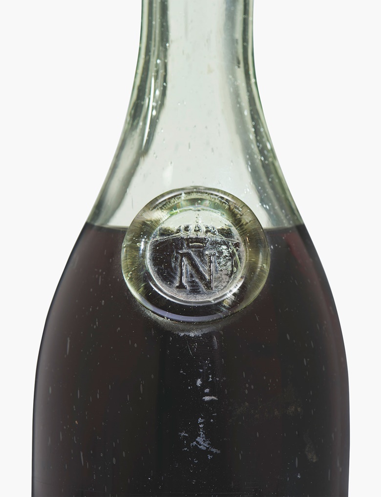 Napoléon Cognac 1811. ‘N’-embossed glass shoulder-button. No label. Embossed short metal capsule states ‘1811 – Maison de L’Empereur – Chateau de Fontainebleau’. Original slightly shrunken cork. Level 6.5 cms below base of cork. 1 bottle. Estimate £4,000-6,000. This lot is offered in Interiors on 14 June 2017 at Christie’s South